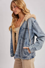 Load image into Gallery viewer, person wearing a Faux Fur Hooded Denim Jacket in a Light Wash