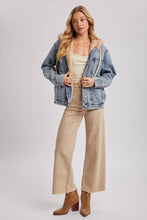 Load image into Gallery viewer, person wearing a Faux Fur Hooded Denim Jacket in a Light Wash