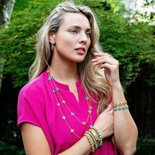 Load image into Gallery viewer, person wearing Capucine de Wulf Berry Gem Turquoise rings, earrings, necklaces and bracelets