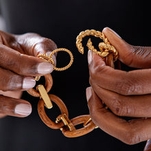 Load image into Gallery viewer, person holding Capucine de Wulf Earth Goddess Link Bracelet in Teak and gold showing the clasp