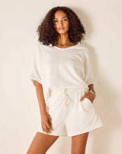 Load image into Gallery viewer, woman standing wearing Mersea Frenchie Pajamas Shorts in white paired with a matching top