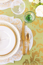 Load image into Gallery viewer, Close up of green paper with gold Damask pattern on a table with a gold and white place setting