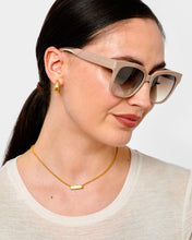 Load image into Gallery viewer, person wearing overside light brown frames with brown lenses