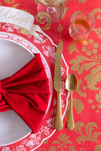 Load image into Gallery viewer, Close up of red paper with gold Damask pattern on a table with a gold and white place setting