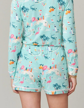 Load image into Gallery viewer, person in pajama shorts and long sleeve shirt, fabric is light blue with many Florida themed motifs