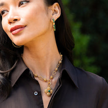 Load image into Gallery viewer, person wearing a Capucine de Wulf Berry Gem Medium Hoop Gold and Malachite Earrings

