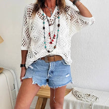 Load image into Gallery viewer, person wearing Knit Diamond Cut-Out Blouse in white with undershirt and jean shorts
