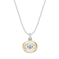 oval shaped cubic zirconia stone surrounded by gold set on a platinum necklace 