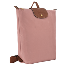 Load image into Gallery viewer, Longchamp Le Pliage Original Backpack - Medium in Pink Tea with brown leather straps and center flap and gold snaps and zipper pull side view to show width

