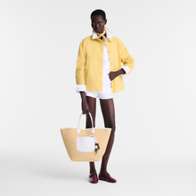 Load image into Gallery viewer, person holding Longchamp Le Pliage Collection Panier Ceramique Large Basket Bag with White leather
