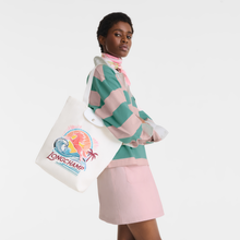 Load image into Gallery viewer, person holding the Longchamp Le Pliage Surf Shoulder Bag - Rainbow under her arm
