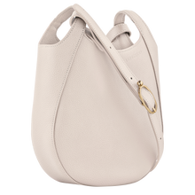 Load image into Gallery viewer, cream colored bag with short side handles  and cross body strap with gold buckle 
