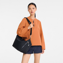 Load image into Gallery viewer, person holding Longchamp Le Pliage Energy Crossbody Bag in Black
