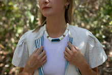 Load image into Gallery viewer, close up of neckline showing striped lining  
