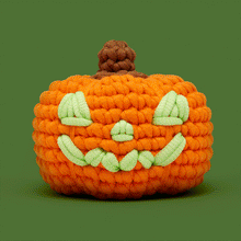 Load image into Gallery viewer, The Woobles Hal the Jack-o'-lantern Crochet Kit with glow in the dark yarn
