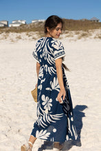 Load image into Gallery viewer, back view of a woman wearing the woman in Cora Caftan on the beach
