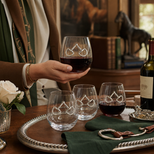 Load image into Gallery viewer, person holding a Equestrian Bit Stemless Wine Glasses with three more glasses on a tray
