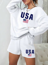 Load image into Gallery viewer, person wearing two-piece set featuring a white long sleeve crewneck sweatshirt and matching white shorts.
