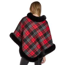 Load image into Gallery viewer, person wearing Plaid Poncho with black trim along hem and neckline back view showing blac red and white plaid pattern
