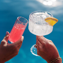 Load image into Gallery viewer, Vietri Superglass Glass filled with drinks being use at a pool
