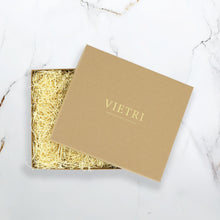 Load image into Gallery viewer, Vietri craft box with gold text filled with packing straw 
