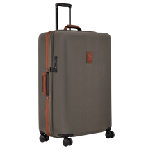 Load image into Gallery viewer, Longchamp Boxford Suitcase Embossed Style xl brown side view showing leather handle and a leather accent along the zipper of the case
