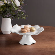 VIDA Havana Small White Pedestal Cake Plate with wavy edges sitting on a wood table
