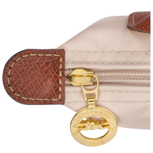 Load image into Gallery viewer, Longchamp Le Pliage Original Pouch w/ Handle - with cream Paper color fabric and brown leather, gold hardware close up of hardware 
