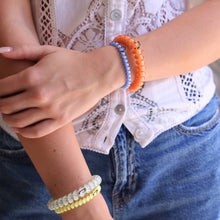 Load image into Gallery viewer, person wearing ties on her wrist 
