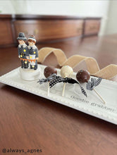Load image into Gallery viewer, Pilgrim Light-Up Sitter on a tray with cake pops
