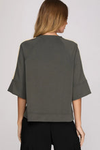 Load image into Gallery viewer, woman wearing gray  shirt with cream colors accents along the side of the sleeves 
