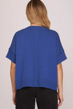 Load image into Gallery viewer, woman in Drop Half Sleeve Crew Neck Sweater Top paired with black pants rib knit along neck sleeves and hem back view
