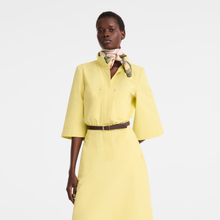 Load image into Gallery viewer, person wearing the Longchamp Soie A Toute Allure Silk Scarf around her neck 
