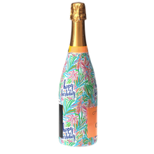 Load image into Gallery viewer, Champagne Bottle covered with the Happy Birthday Floral Bottle wrap text reads happy birthday Champagne cheers brut side view
