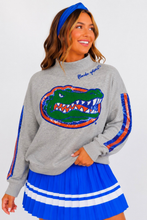 Load image into Gallery viewer, person wearing the Florida Mock Neck Sequin Stripe Sweatshirt
