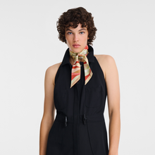 Load image into Gallery viewer, person wearing the Longchamp En Pleine Vague Silk Headband around their neck
