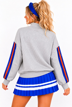 Load image into Gallery viewer, Florida Mock Neck Sequin Stripe Sweatshirt back view showing gray fabric and blue and orange stripes 
