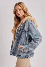 Load image into Gallery viewer, person wearing a Faux Fur Hooded Denim Jacket in a Light Wash
