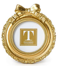 Load image into Gallery viewer, Gold round frame with a bow on top
