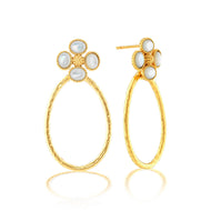 gold post earring with a clover shaped design using four white stones around a center gold berry, below the clover is a gold oval shaped hoop