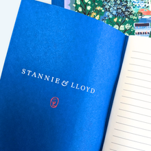 Load image into Gallery viewer, blue interior of the note book with lined paper
