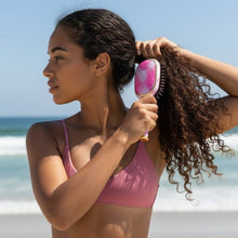 Load image into Gallery viewer, person using the TELETIES Mini Detangler Brush in size  Medium and style Pinch Me!
