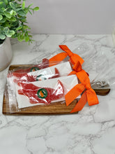 Load image into Gallery viewer, three Florida Citrus Candy, Alligator Delicacy, Orange, 2oz in packaging 

