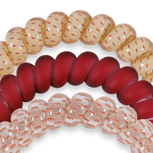 Load image into Gallery viewer, close up of the TELETIES Spiral Hair Coils Large Go Noles! Hair Ties showing small Noles logos
