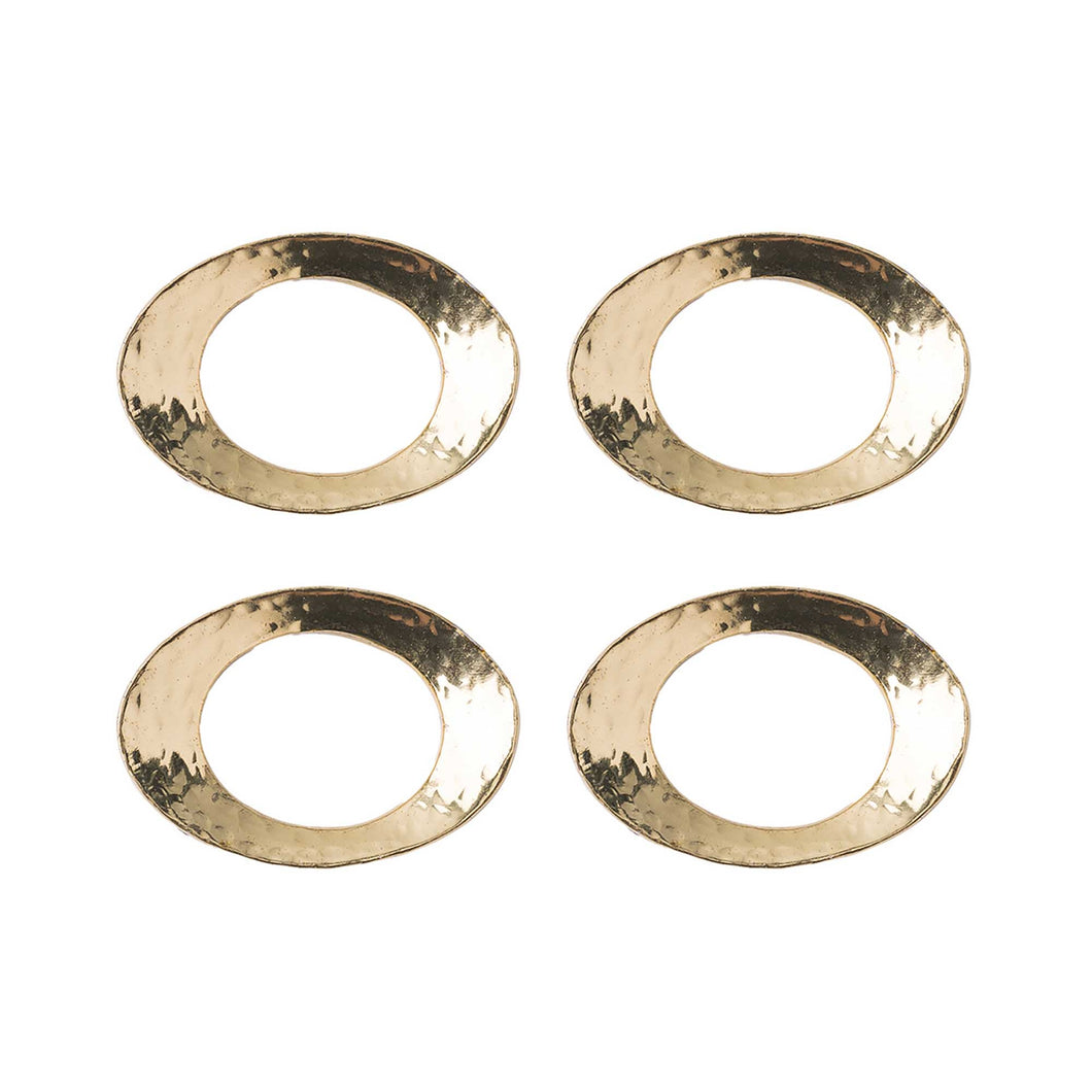 Four gold oval shaped napkin rings with a hammered texture