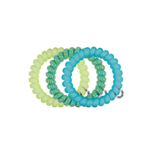 Load image into Gallery viewer, three TELETIES Cabana Cutie Hair Ties one light blue, green and teal stripes, and blue
