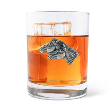 Load image into Gallery viewer, short glass with pewter motif of two horse heads glass is filled with ice and amber liquid
