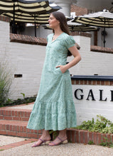 Load image into Gallery viewer, woman in long dress with short sleeves and green Blockprint side view showing pockets 

