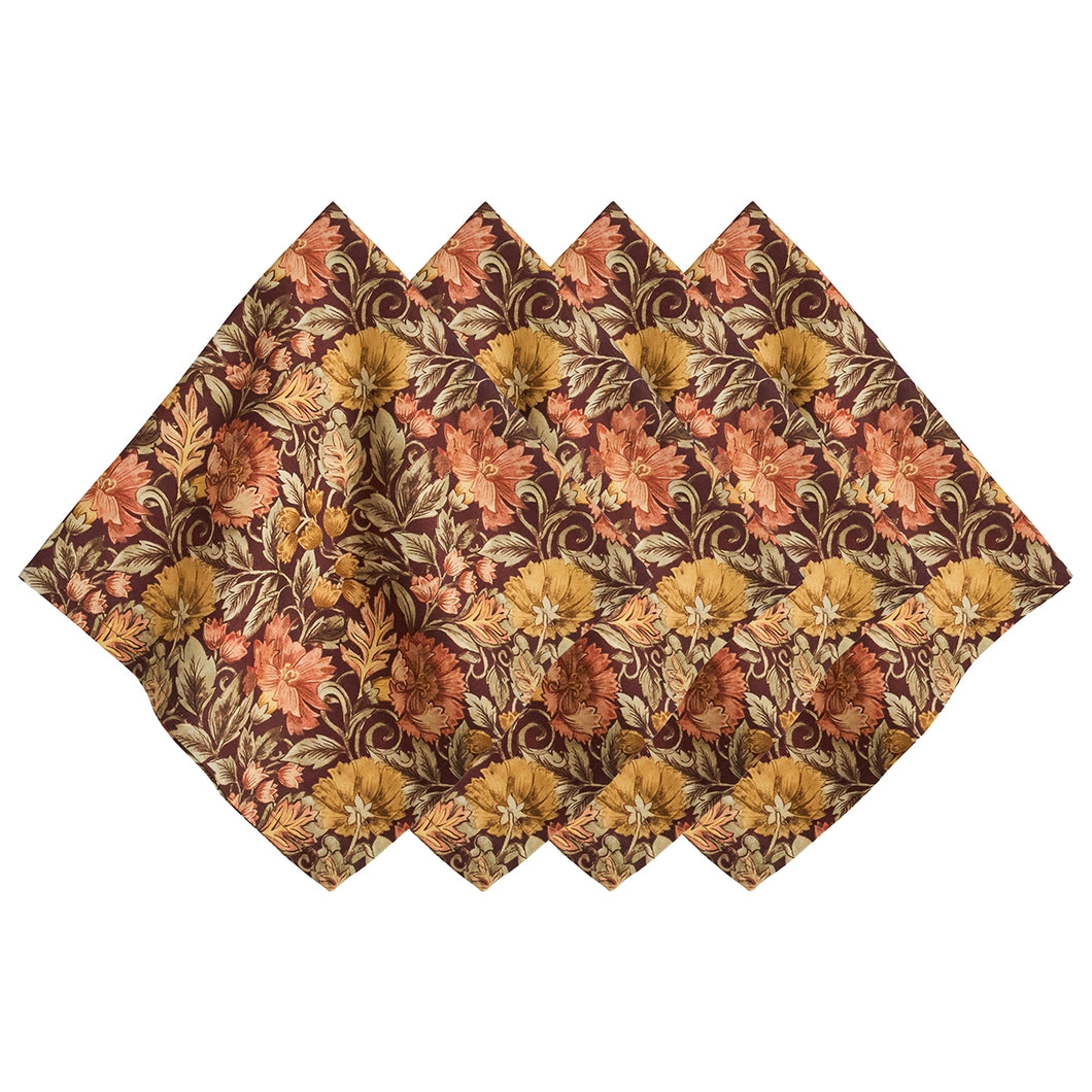 Four napkins with a floral pattern in earth tones