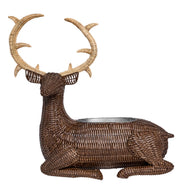 Rattan woven sitting deer with antlers and basket bowl in its back